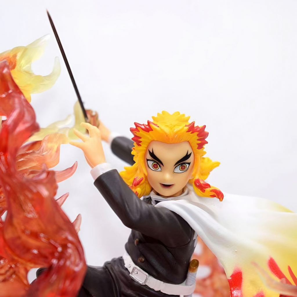 Action figure with fiery hair and a sword, set against a white background. Demon Slayer