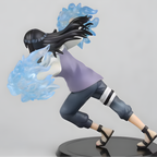 Figurine of a character with black hair and blue energy effects on a gray. Hinatabackground