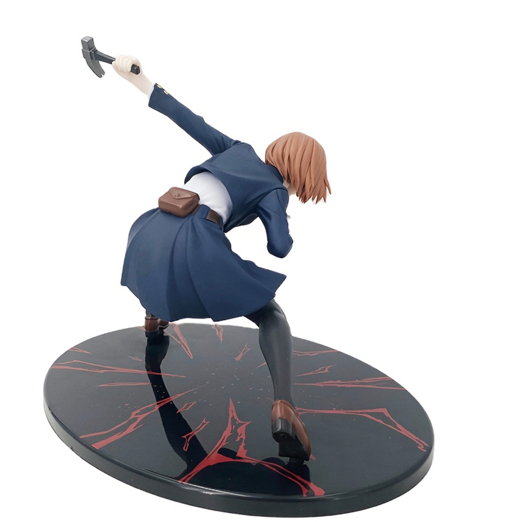 Figurine of a character in a dynamic pose on a black base with red accents