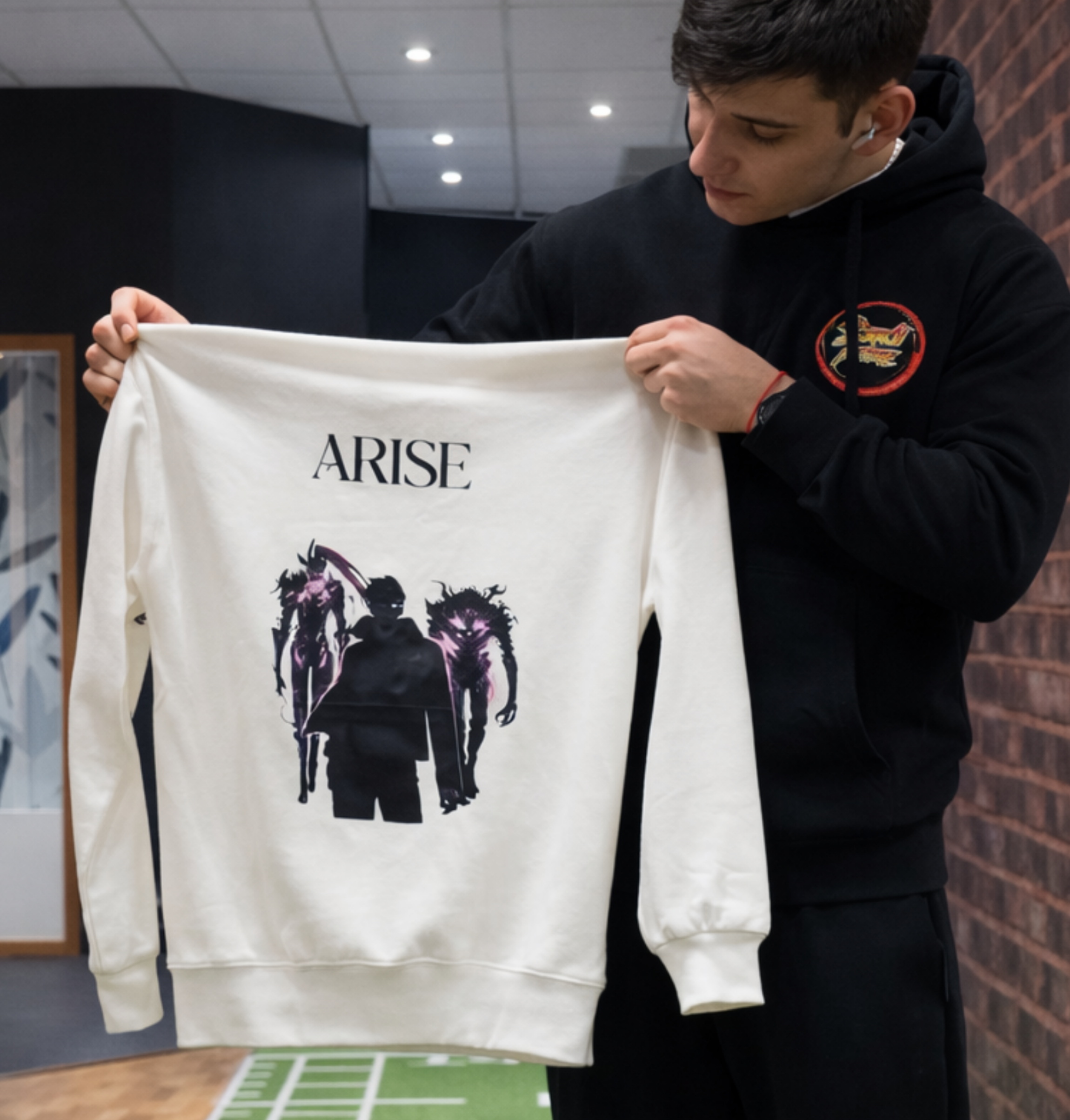 Black Solo Leveling Arise hoodie by ScandiAnime featuring a front graphic design with bold lettering and character artwork.