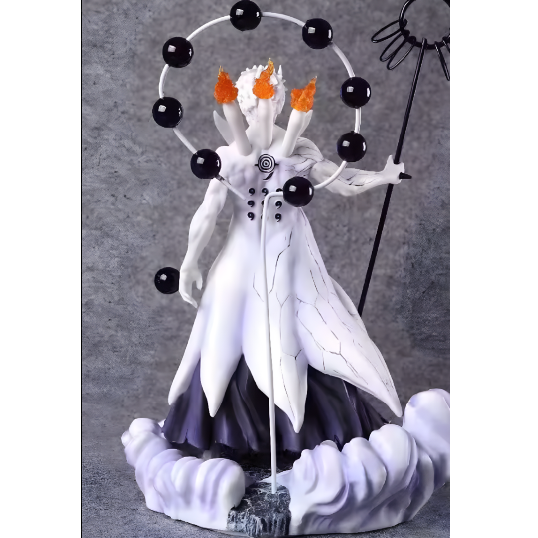 Detailed figurine of a character with white and black attire, holding a staff and surrounded by black spheres on a gray background.