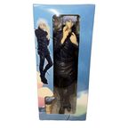 Action figure in packaging with a blue sky and cloud background